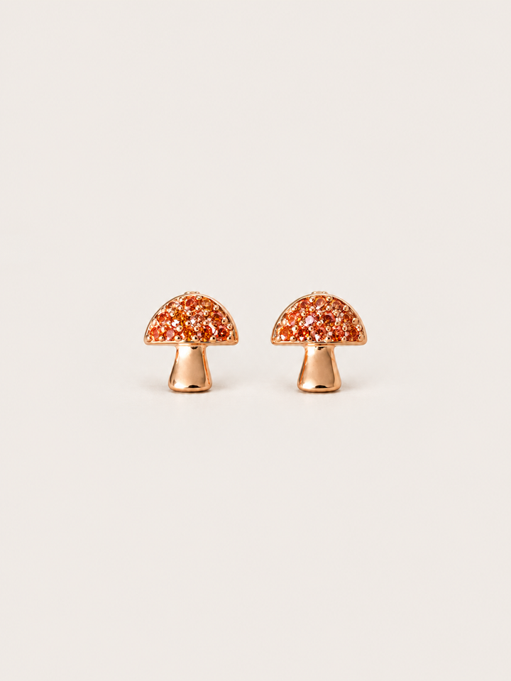 Mushroom Stud Earrings shown on a warm neutral background