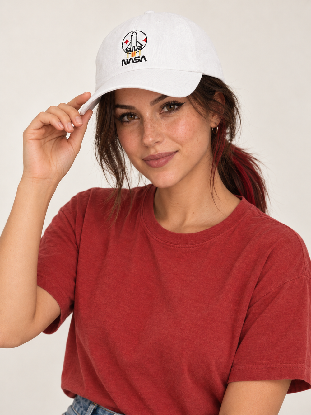 Model wearing the white NASA embroidered baseball cap
