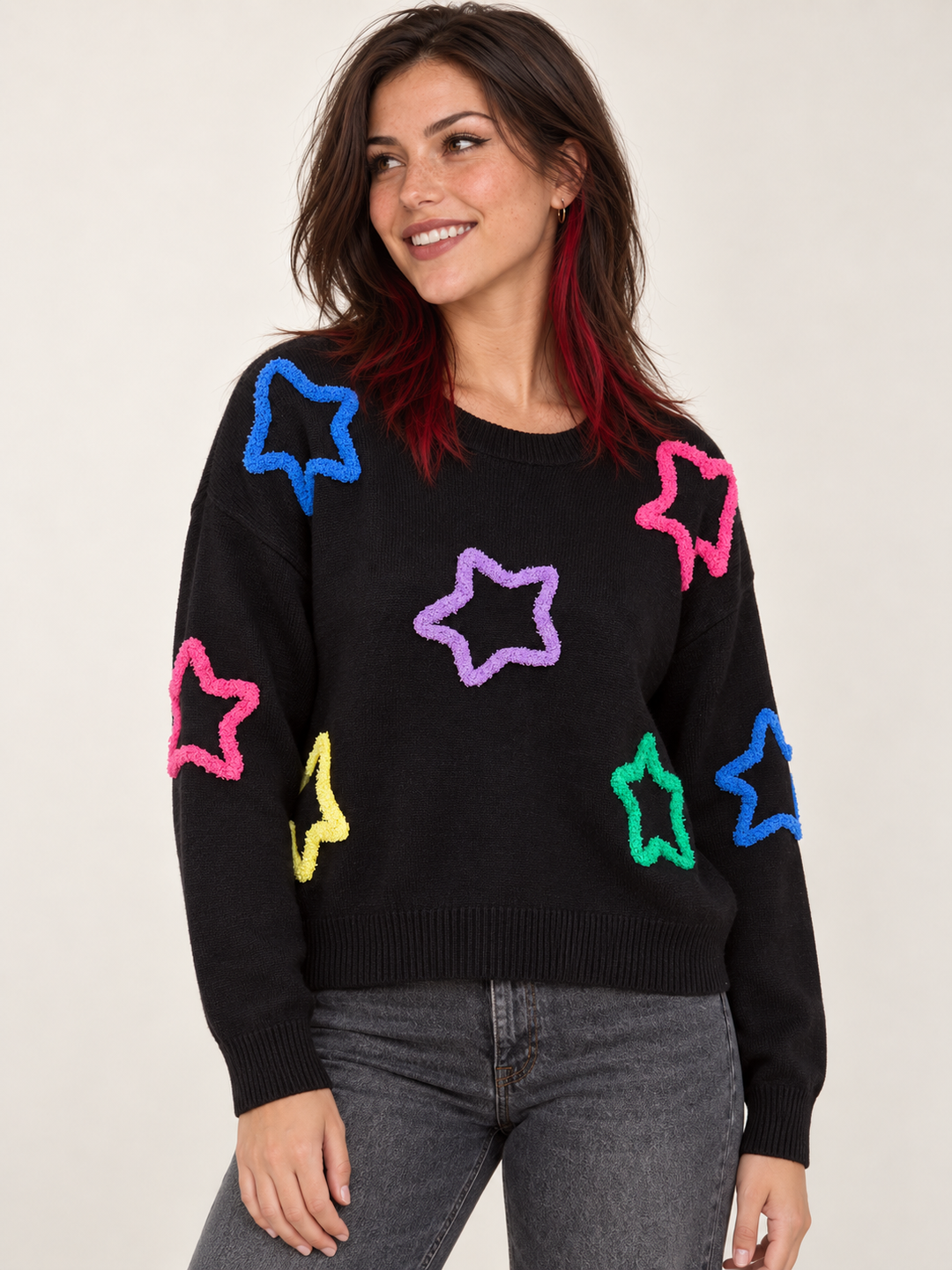 Model wearing Neon Fuzzy Star Sweater, angled view