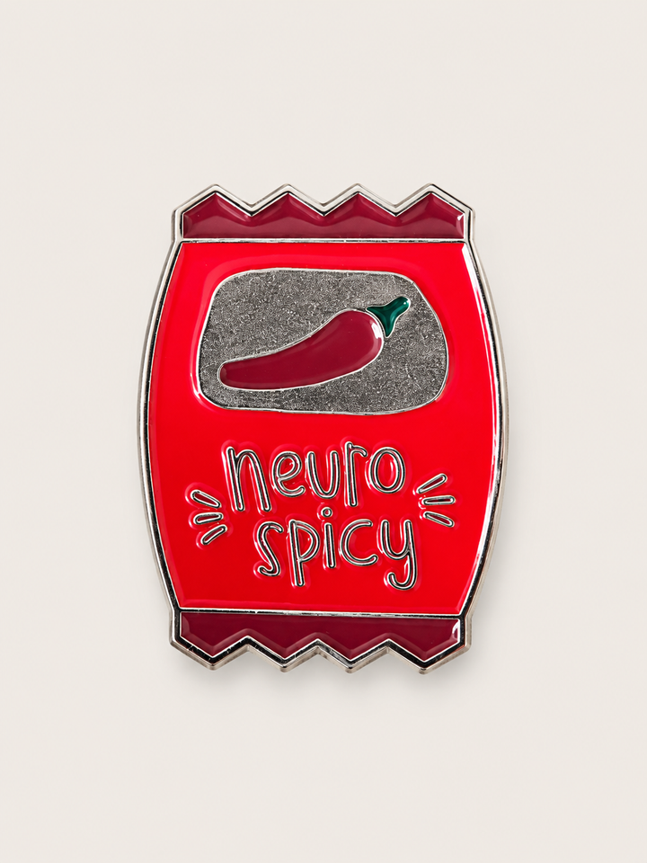Neuro Spicy Chip Bag Pin shown on a warm neutral background