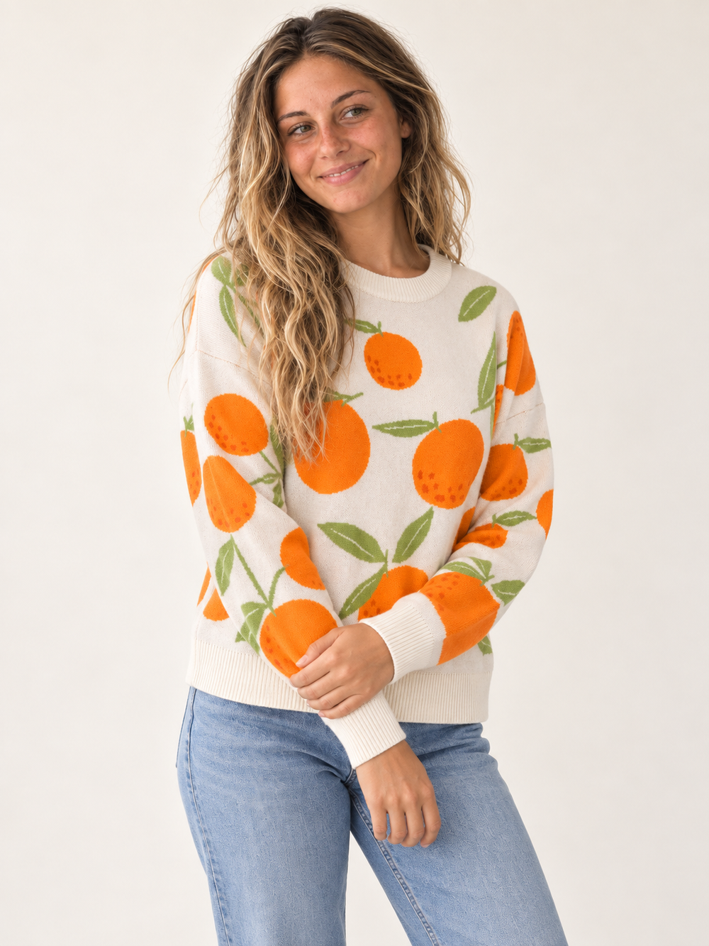 Orange sweater three-quarter view on model