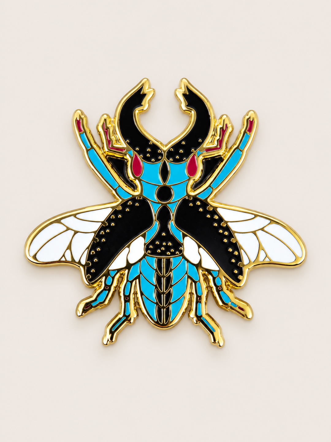 Ornate Winged Beetle Pin shown on a warm neutral background