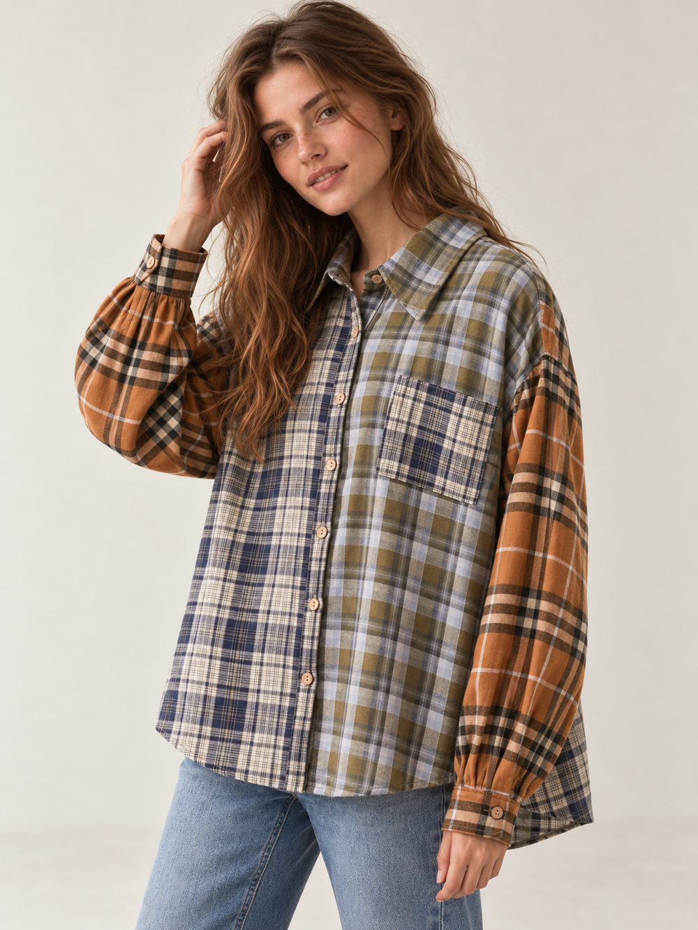 Oversized mixed plaid button-up shirt in navy, olive, cream and rust, 45-degree model view