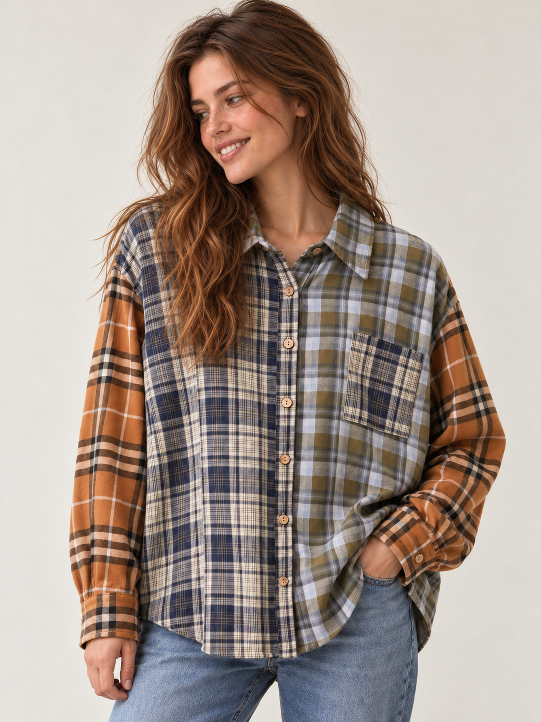 Oversized mixed plaid button-up shirt in navy, olive, cream and rust, front model view