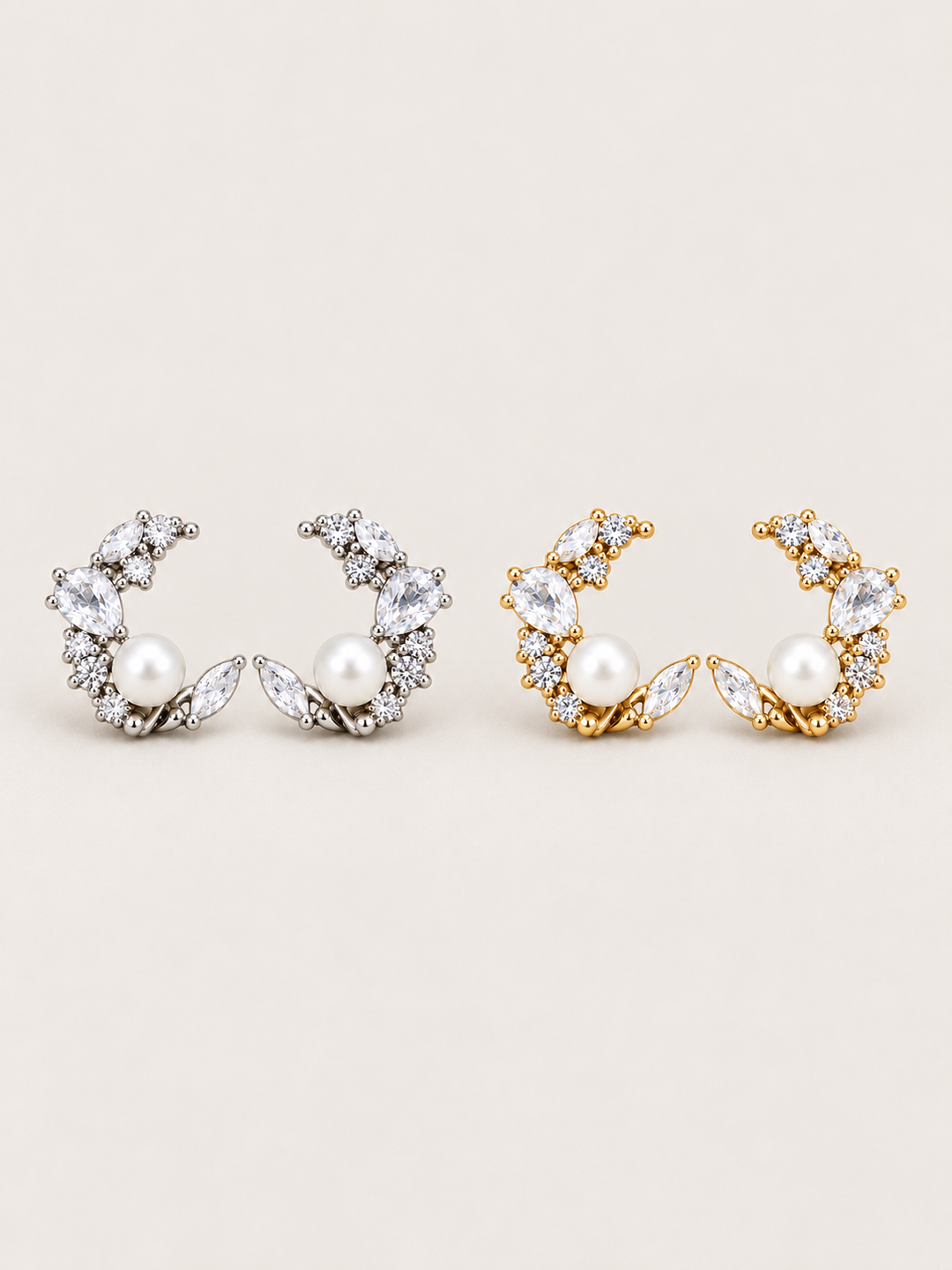 Pearl Crystal Crescent Earrings in silver and gold shown on a warm neutral background