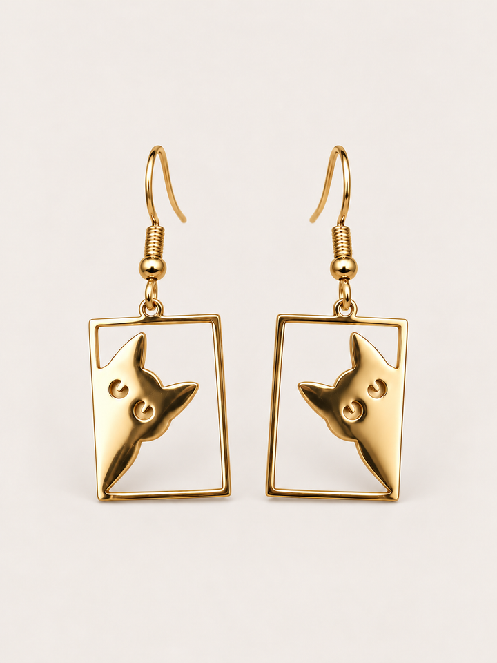 Gold Peeking Cat Rectangle Drop Earrings shown on a warm neutral background