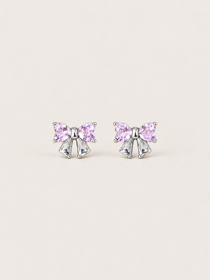 Pink Crystal Bow Stud Earrings shown on a warm neutral background
