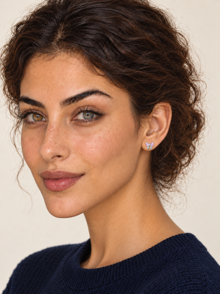 Pink Crystal Bow Stud Earrings worn on a model