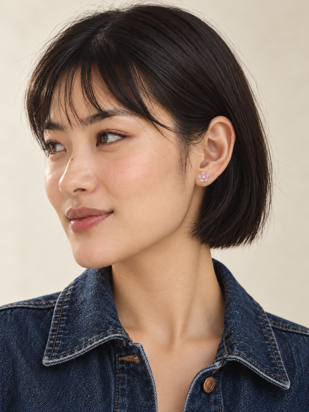 Pink Flower Stud Earrings worn on the viewer-right ear