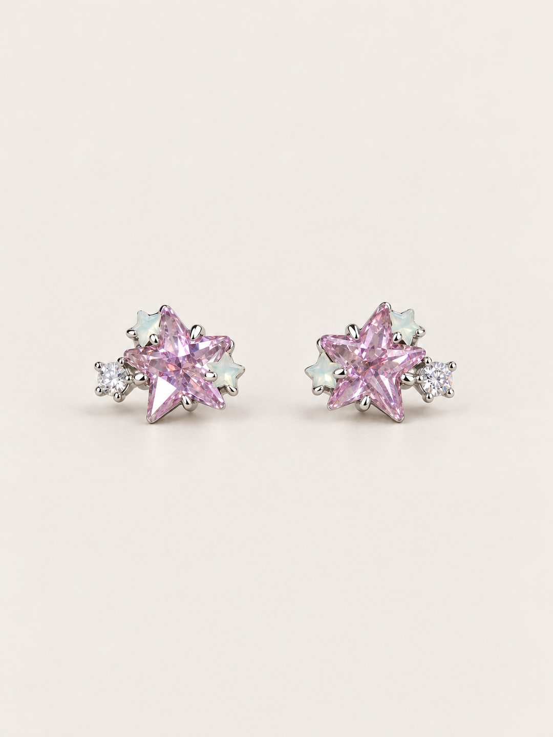 Pink Star Cluster Stud Earrings shown on a warm neutral background