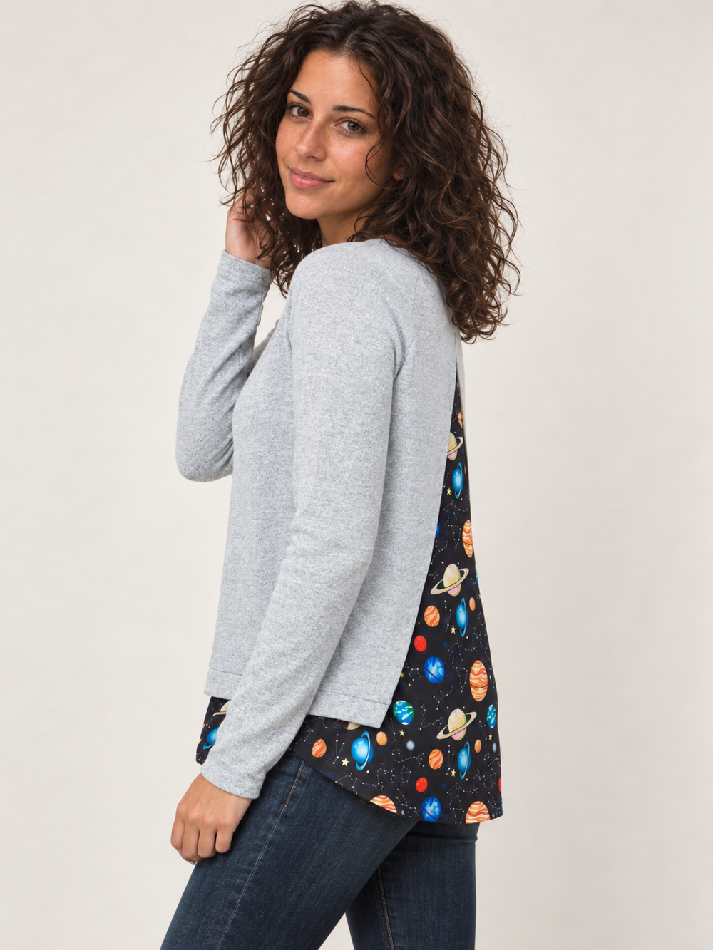 Model wearing Planets Open Back Sweater, angled view