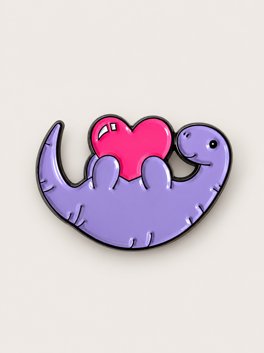 Purple Dinosaur Heart Pin shown on a warm neutral background