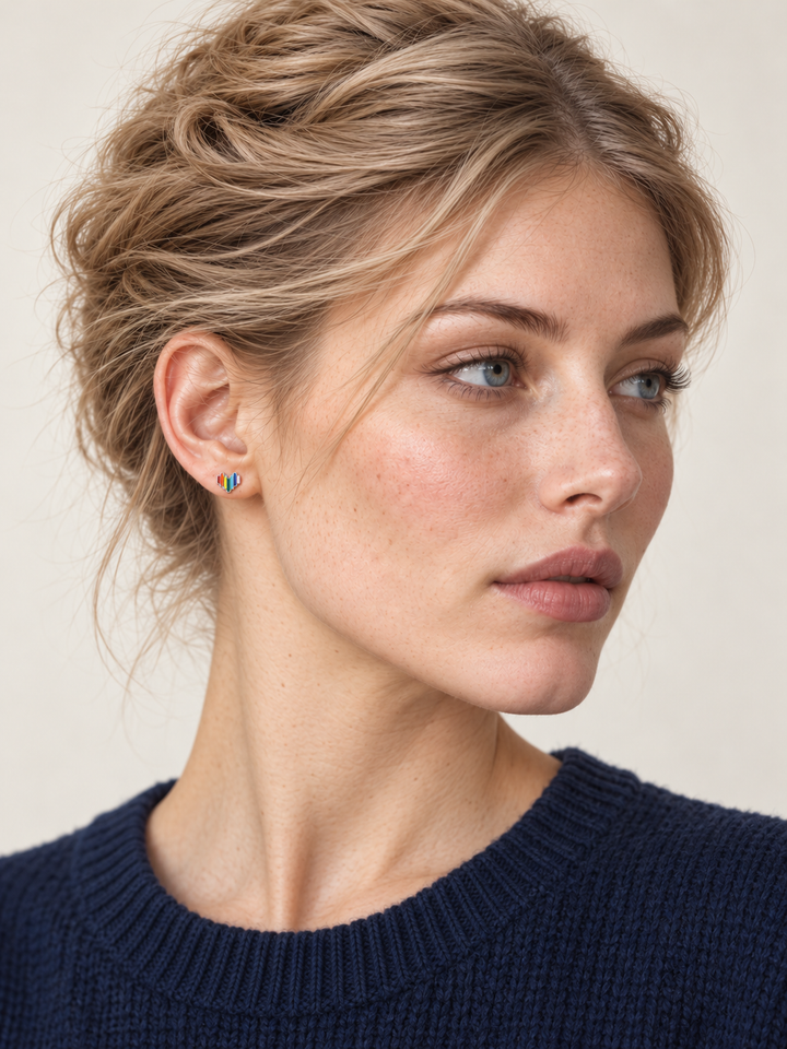 Rainbow Heart Stud Earrings worn on a model