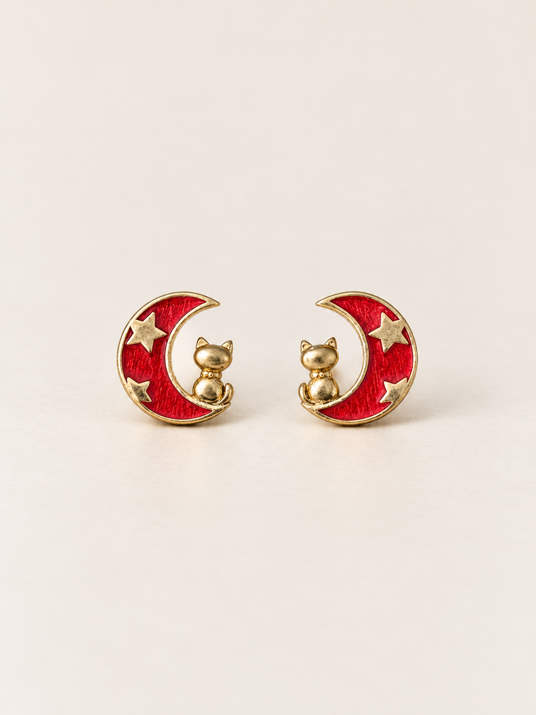 Red Moon and Cat Stud Earrings shown on a warm neutral background