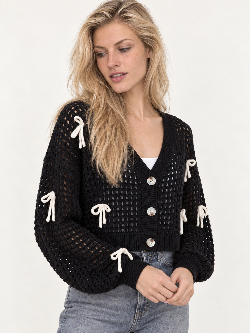 Model wearing the Ribbon Open Knit Cardigan Black — angled view