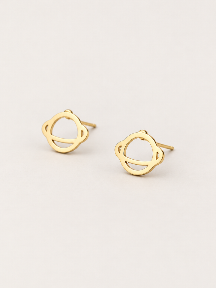 Ringed Planet Stud Earrings gold angled view on a warm neutral background
