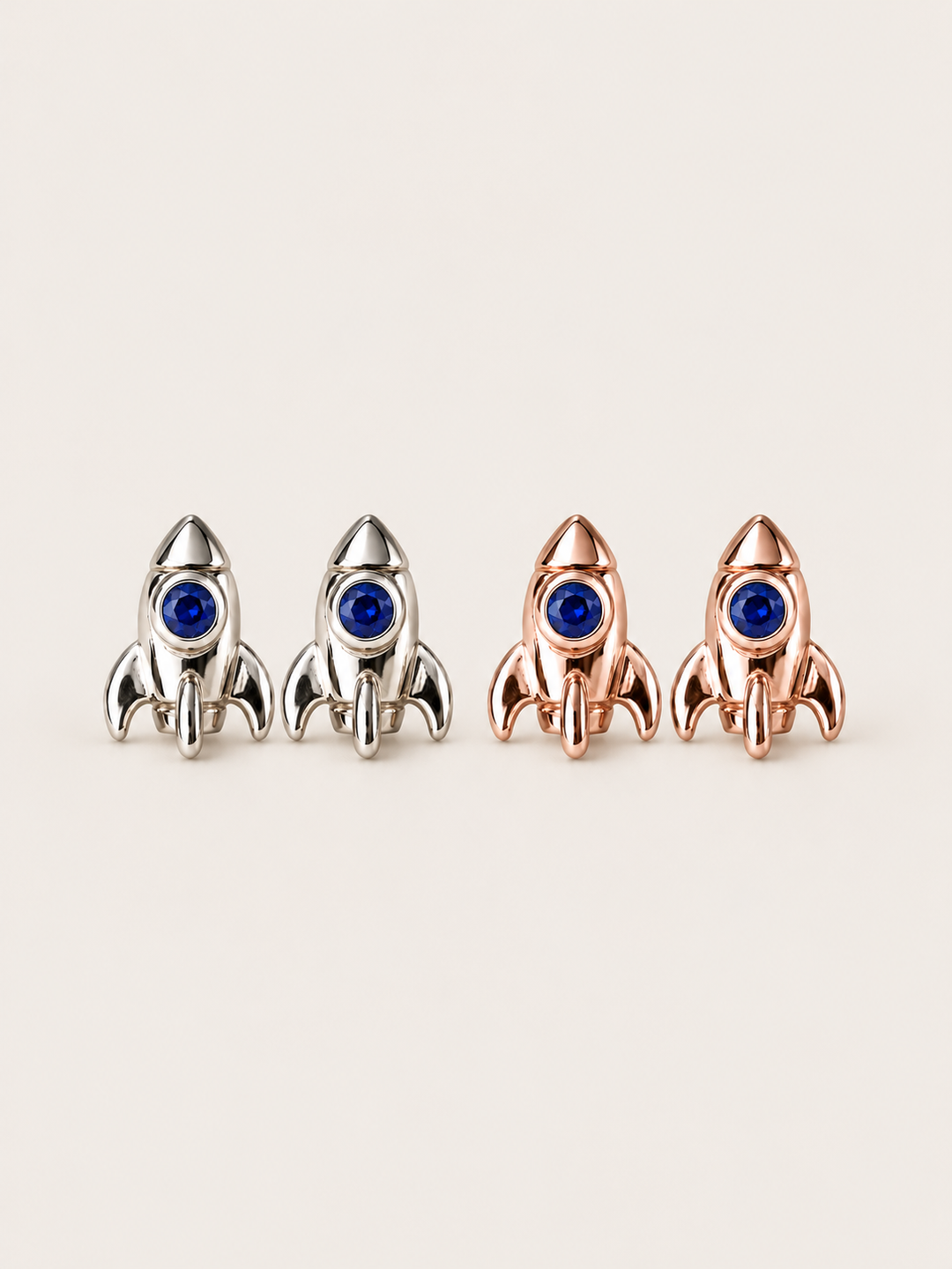 Rocket Stud Earrings in Silver and Rose Gold shown on a warm neutral background