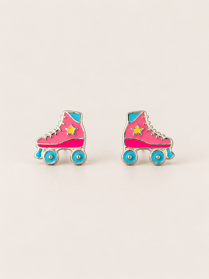 Roller Skate Stud Earrings shown on a warm neutral background