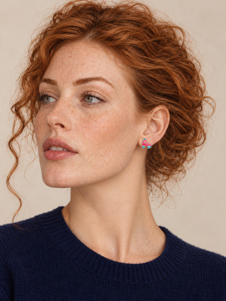 Roller Skate Stud Earrings worn on a model’s viewer-right ear