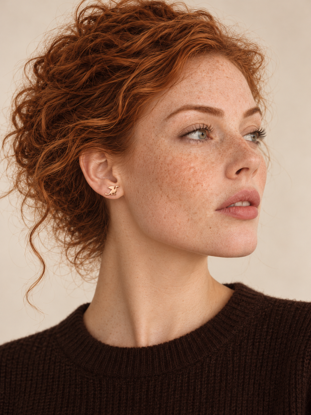 Rose gold Dragon Stud Earrings worn on the viewer-left ear