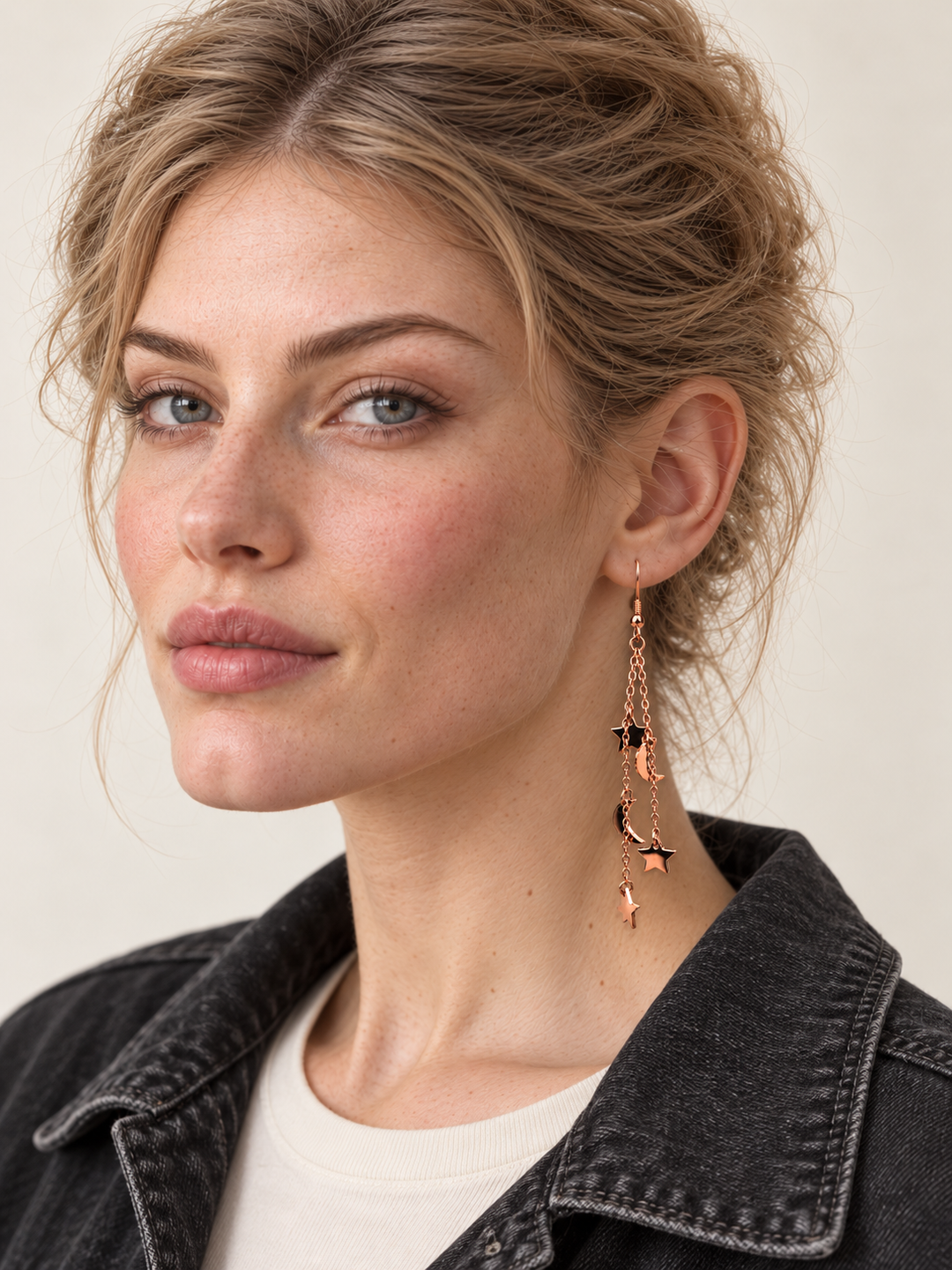 Rose Gold Moon and Star Chain Drop Earrings worn on the viewer-right ear