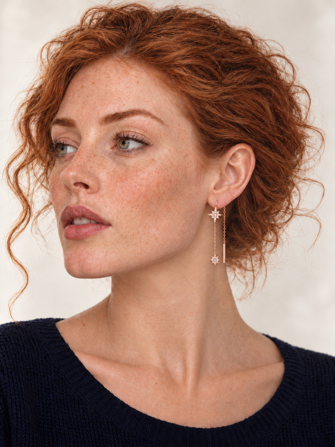 Crystal Starburst Threader Earrings in rose gold worn on a model
