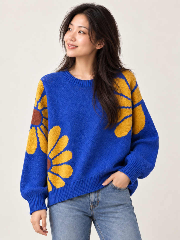 Front view of royal blue daisy knit sweater with ribbed trim