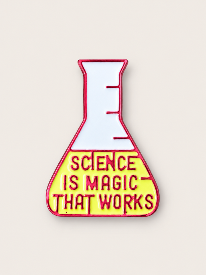 Science Is Magic That Works Flask Pin shown on a warm neutral background