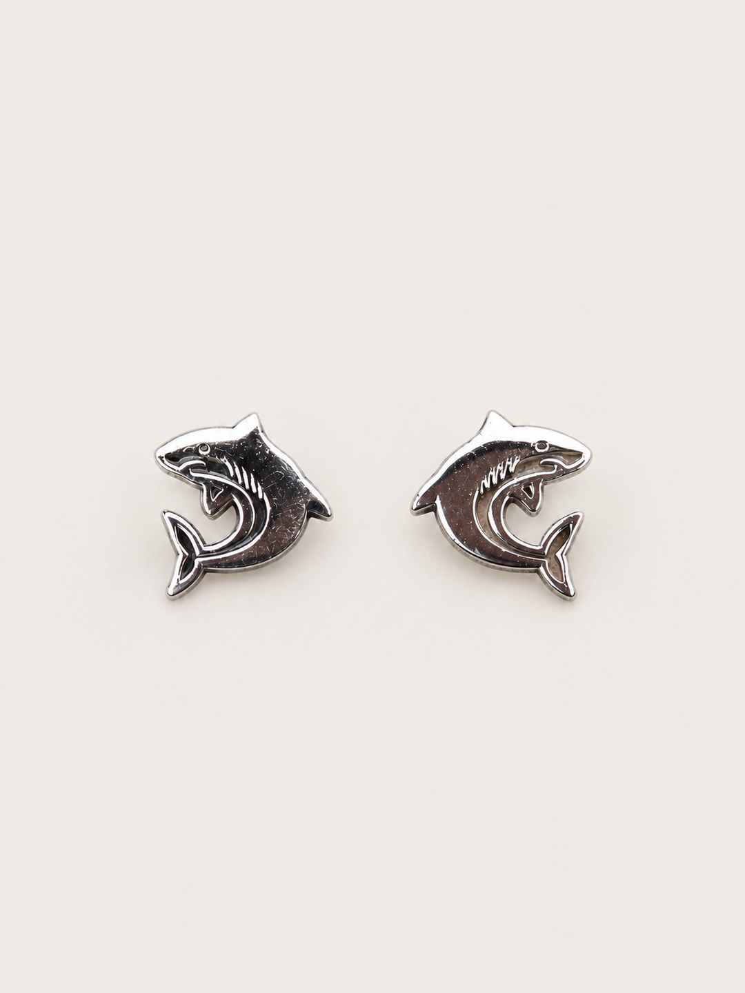 Shark Stud Earrings shown on a warm neutral background