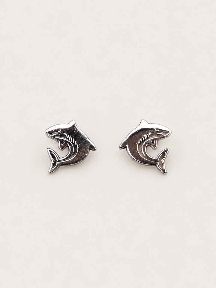 Shark Stud Earrings shown on a warm neutral background