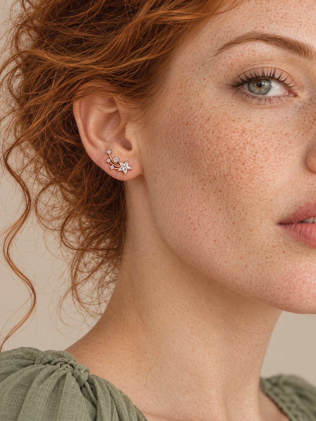 Rose gold Shooting Star Earrings worn on the viewer-left ear