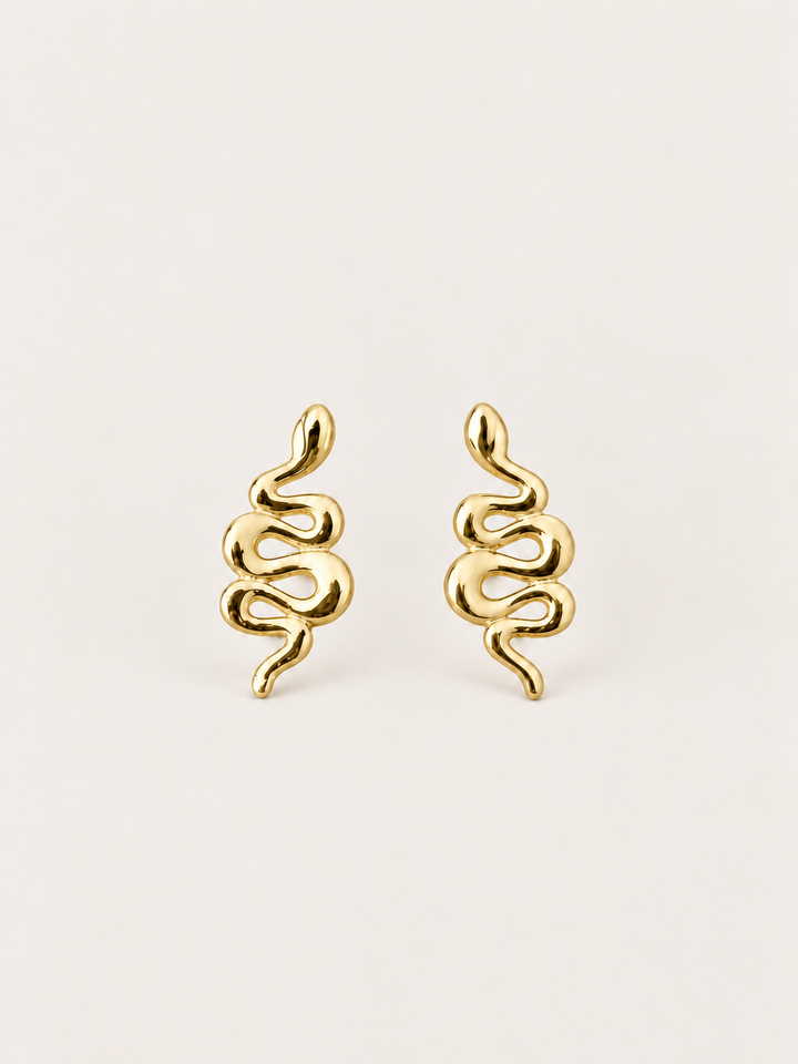 Gold Snake Stud Earrings shown on a warm neutral background
