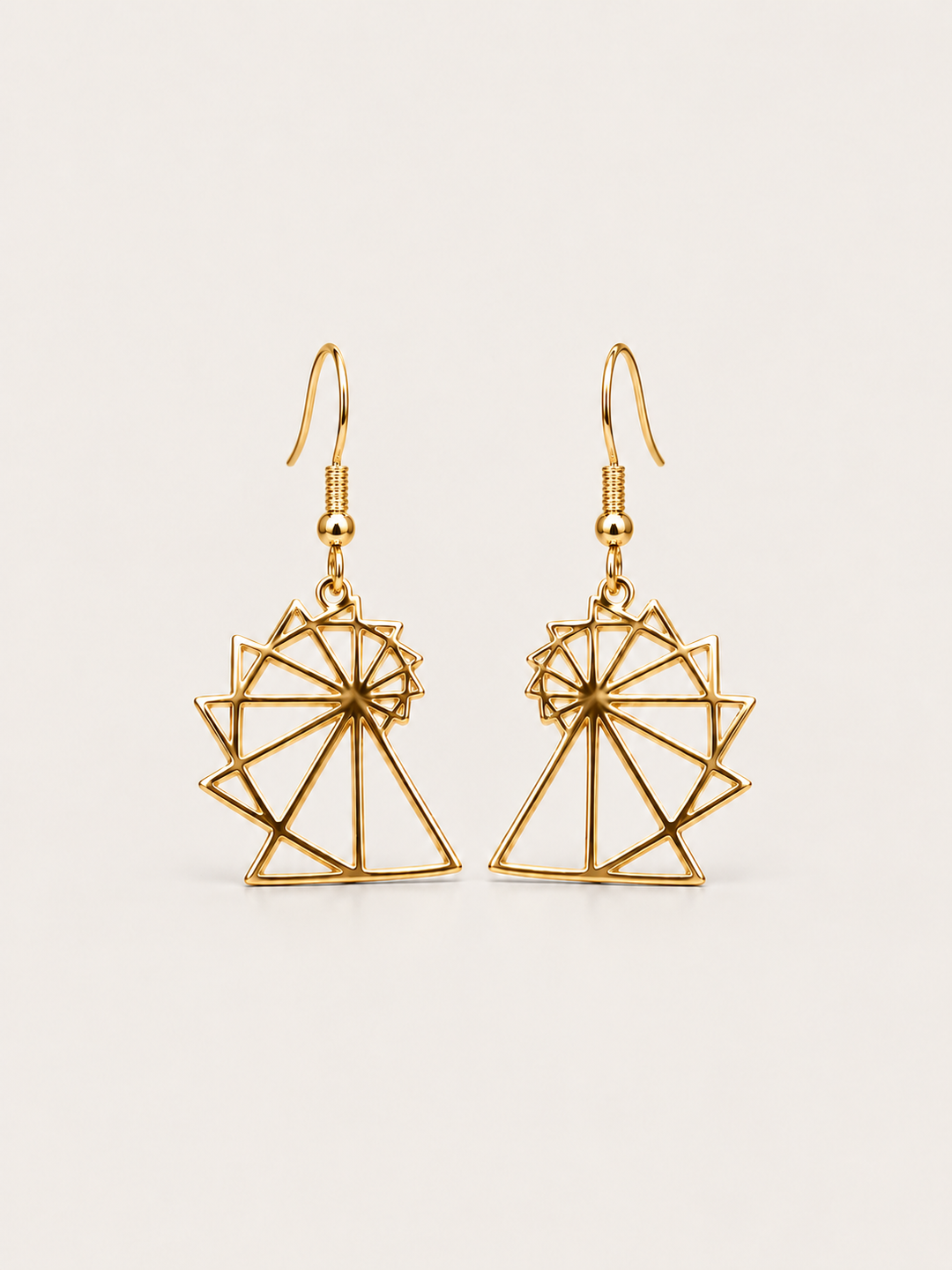 Spiral of Theodorus Earrings in Gold shown on a warm neutral background