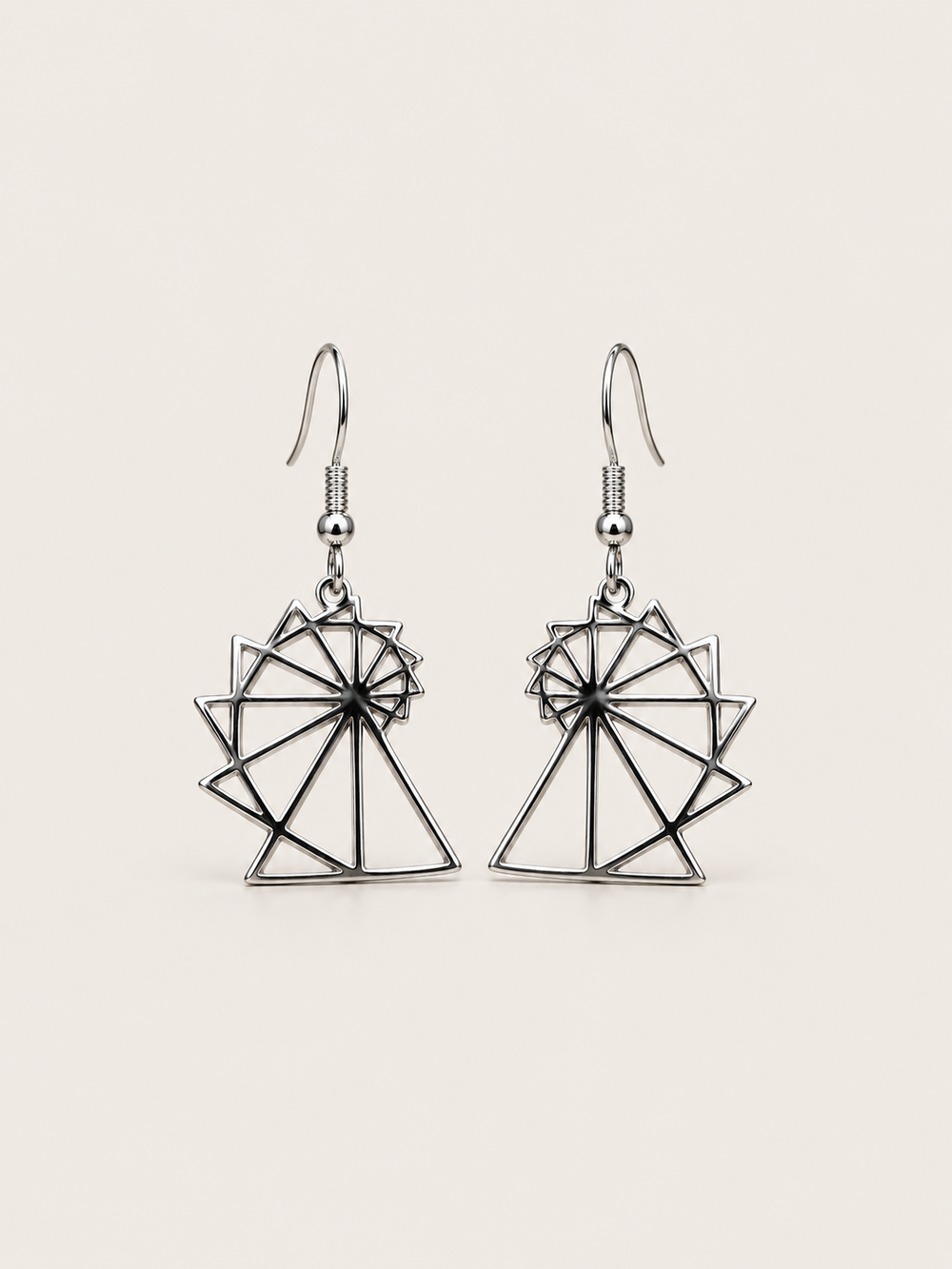 Spiral of Theodorus Earrings in Silver shown on a warm neutral background