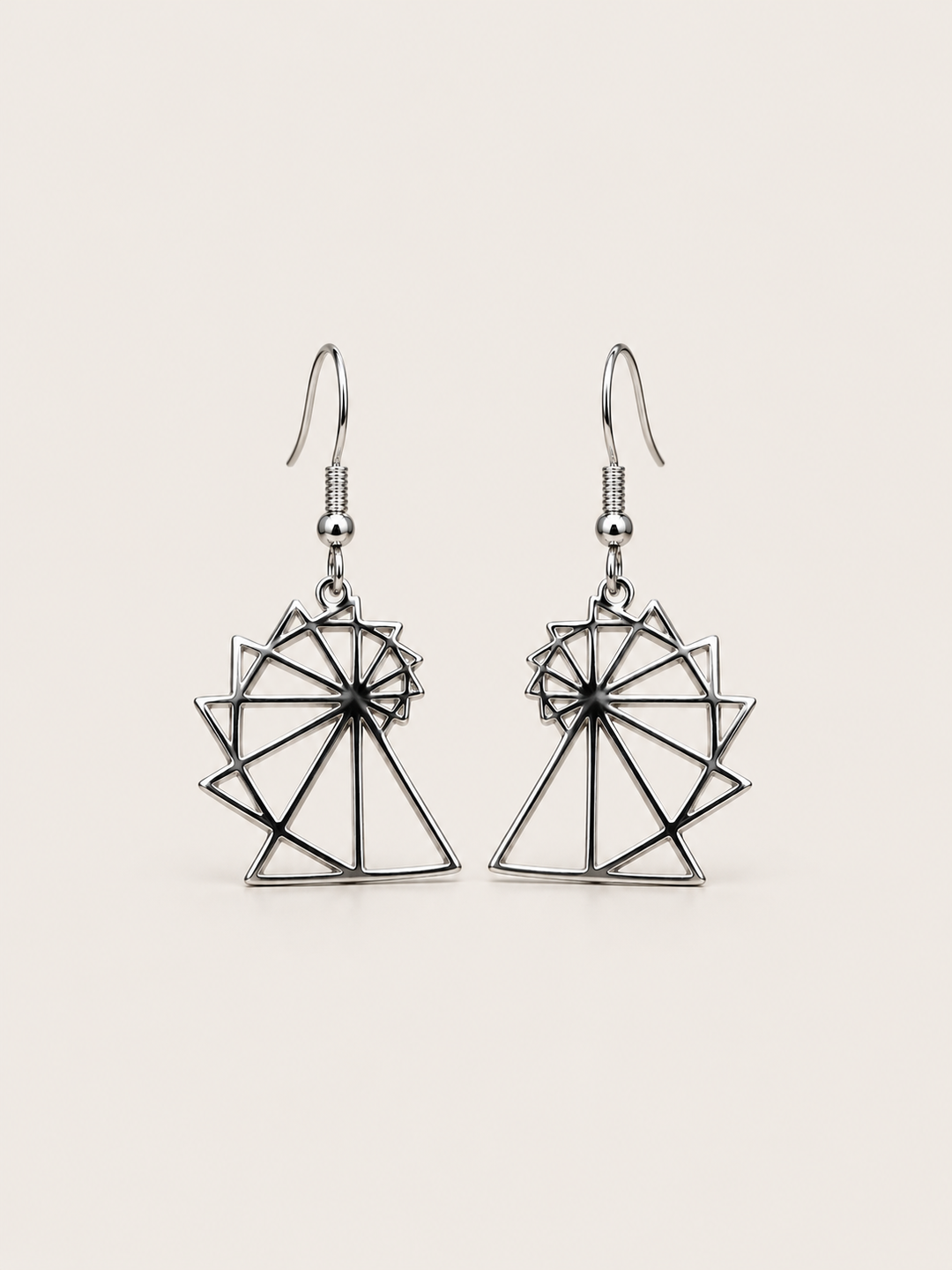 Spiral of Theodorus Earrings in Silver shown on a warm neutral background