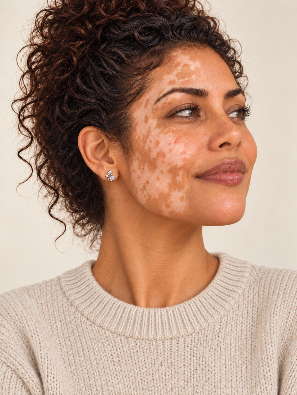 Star and Crystal Cluster Stud Earrings worn on a model in an oatmeal sweater