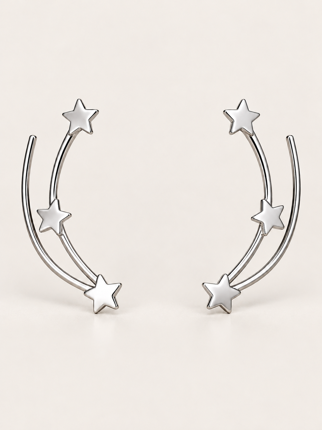 Star Ear Crawler Earrings shown on a warm neutral background