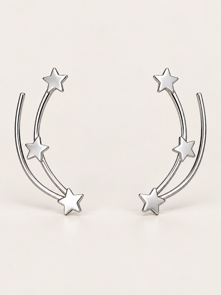 Star Ear Crawler Earrings shown on a warm neutral background