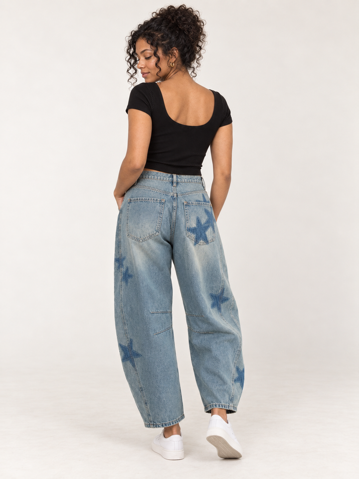 Model wearing Star Printed Washed Denim Barrel Jeans, back view