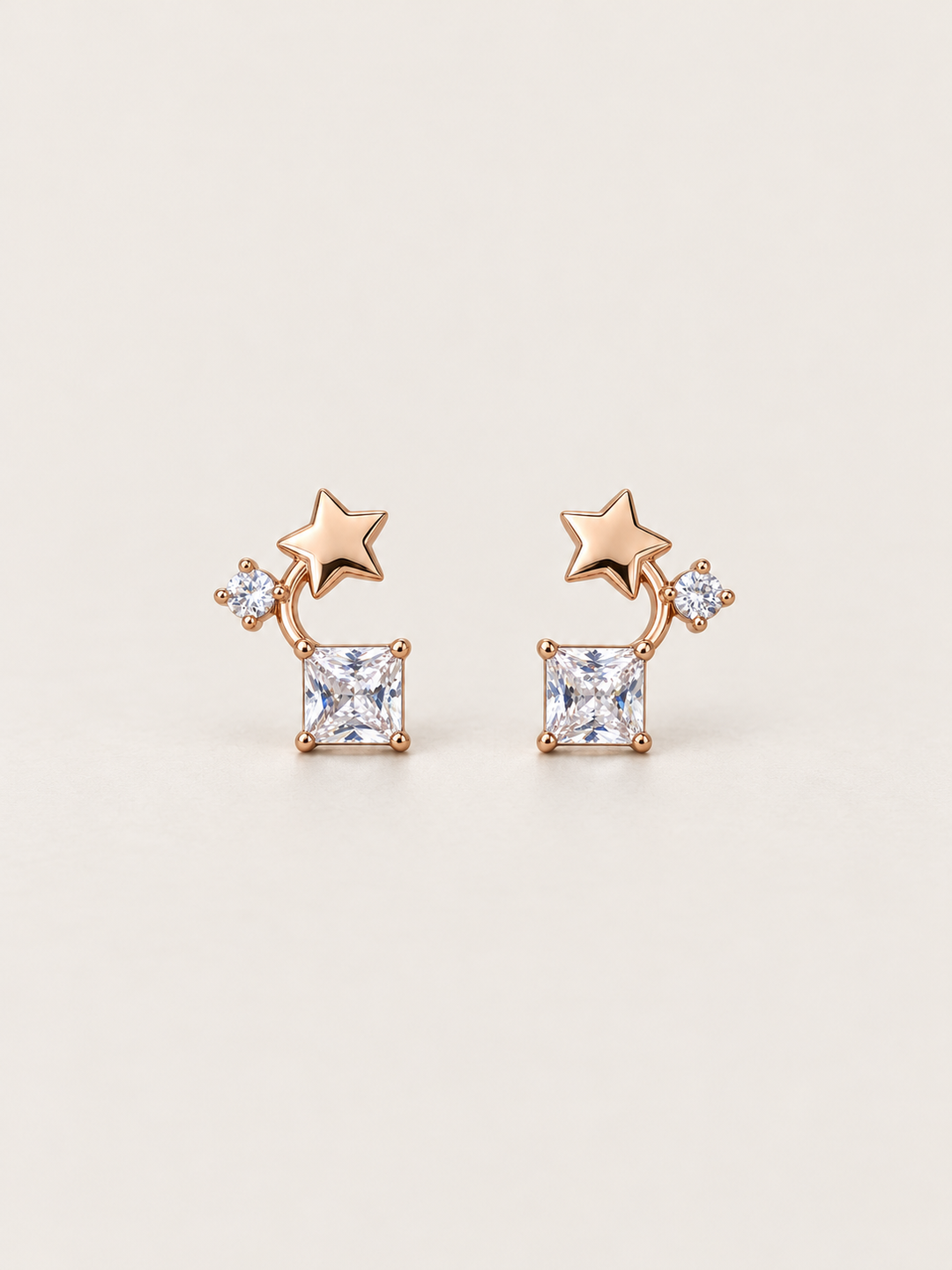 Star and Square Crystal Earrings shown on a warm neutral background
