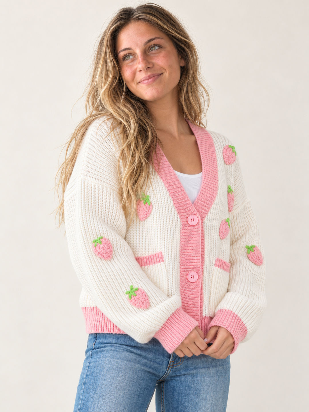 Model wearing Strawberry Button Up Cardigan Pink — three-quarter view