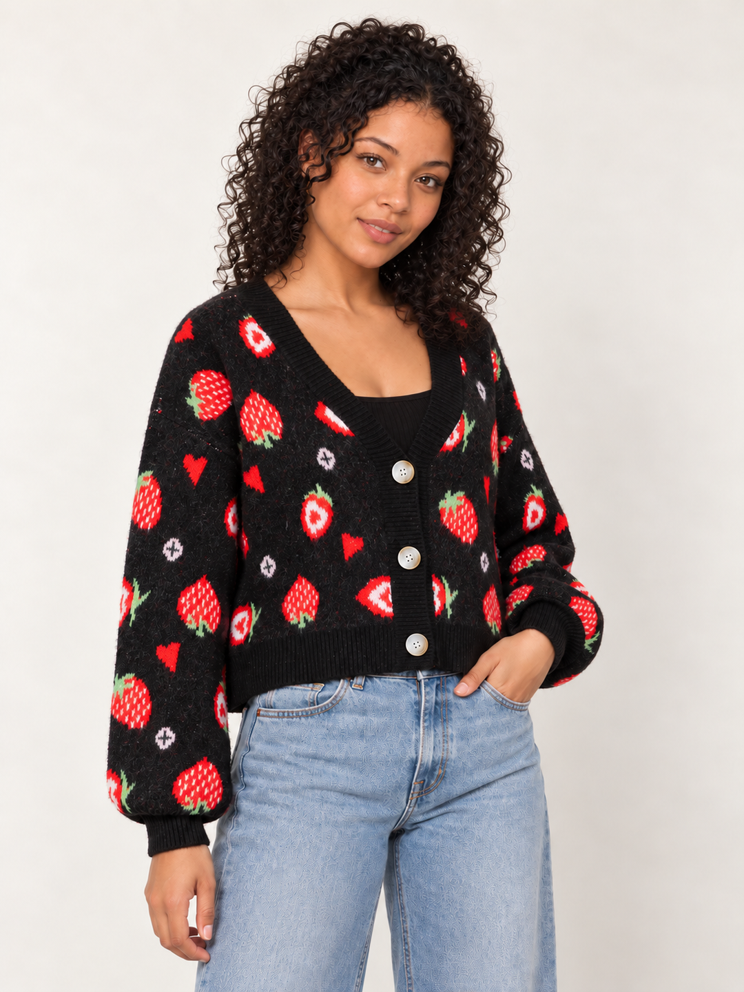 Model wearing Strawberry Heart Cardigan Black, angled view