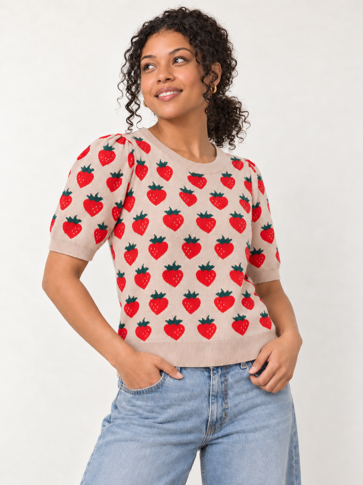 Model wearing strawberry knit short sleeve top in camel, angled view