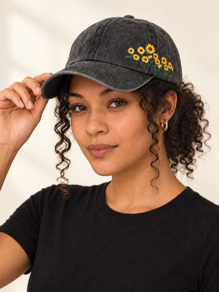 Model wearing Sunflower Hat Black with hand at brim