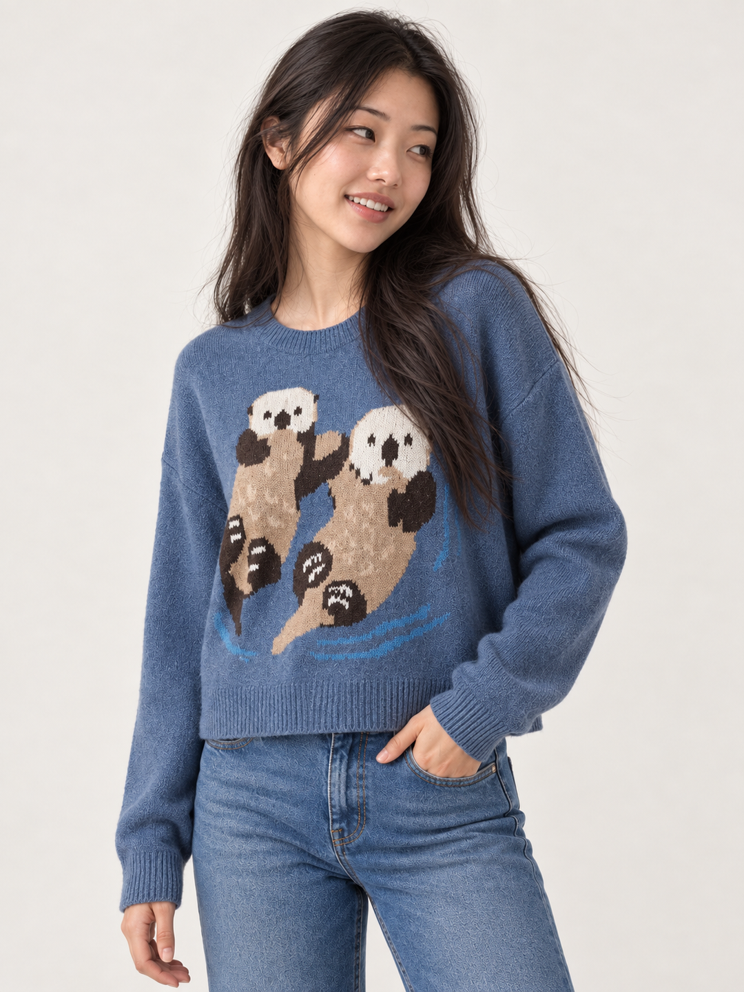 Model wearing Swimming Otters Sweater Blue, angled view