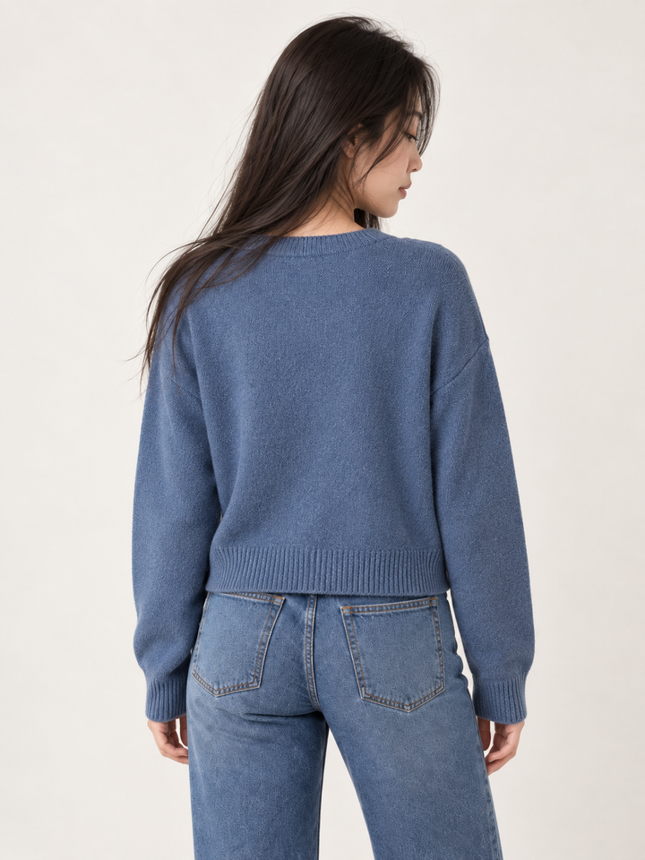 Model wearing Swimming Otters Sweater Blue, back view