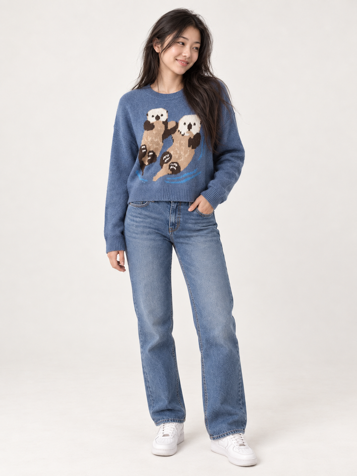 Model wearing Swimming Otters Sweater Blue, full-body view