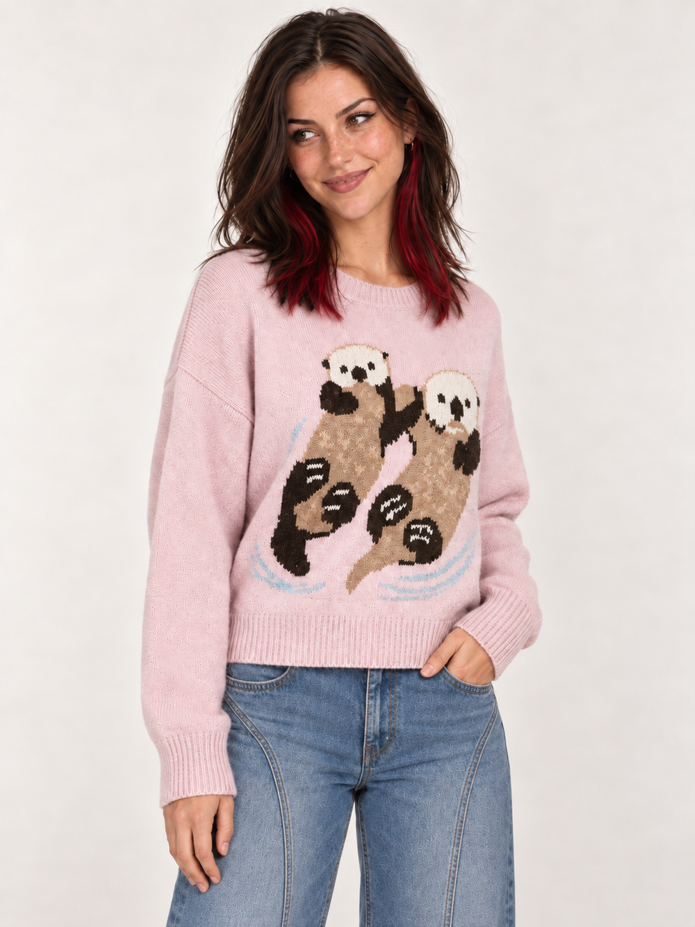 Three-quarter view of model wearing Swimming Otters Sweater Pink