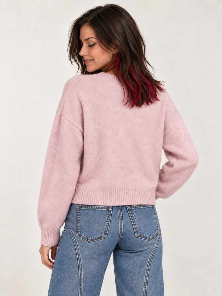 Back view of model wearing Swimming Otters Sweater Pink