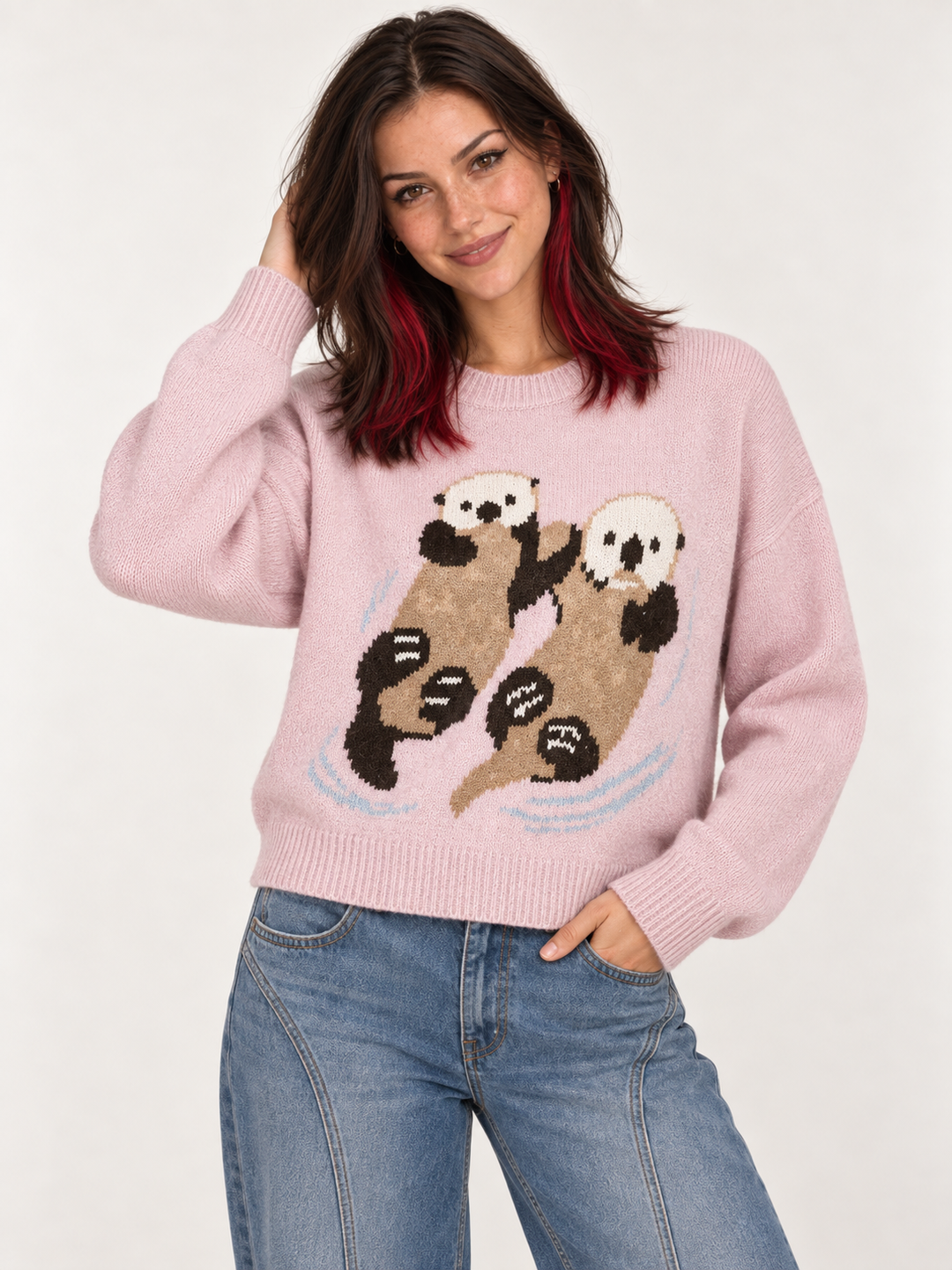Front view of model wearing Swimming Otters Sweater Pink